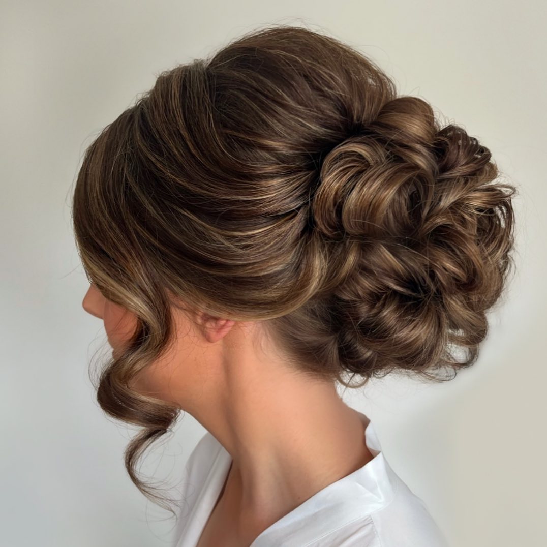 messy yet elegant curly bun