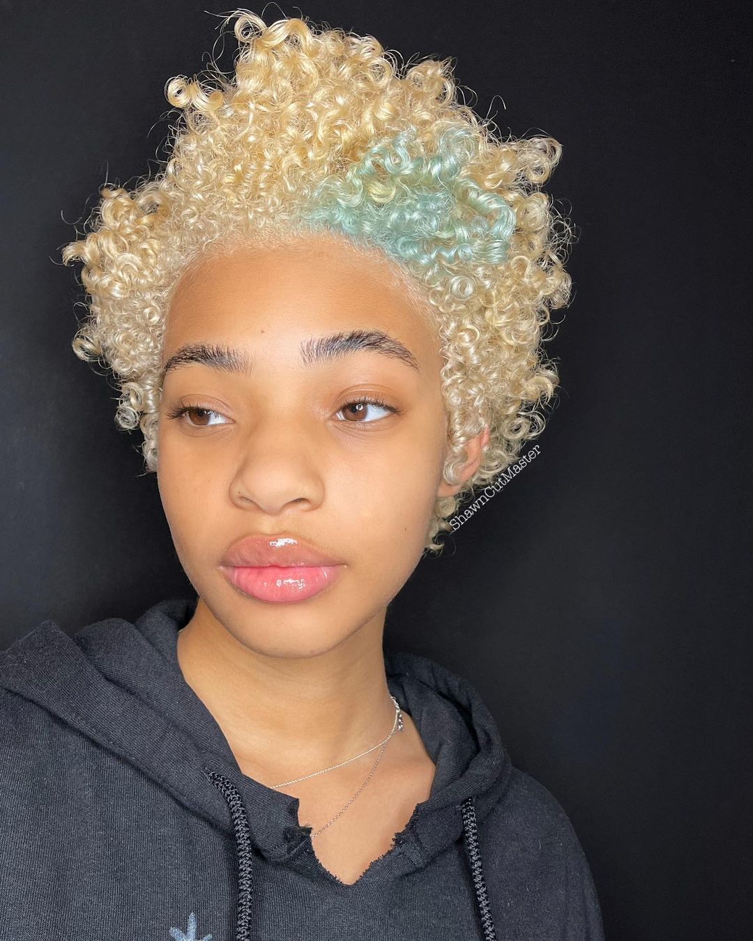 blonde voluminous curly pixie cut