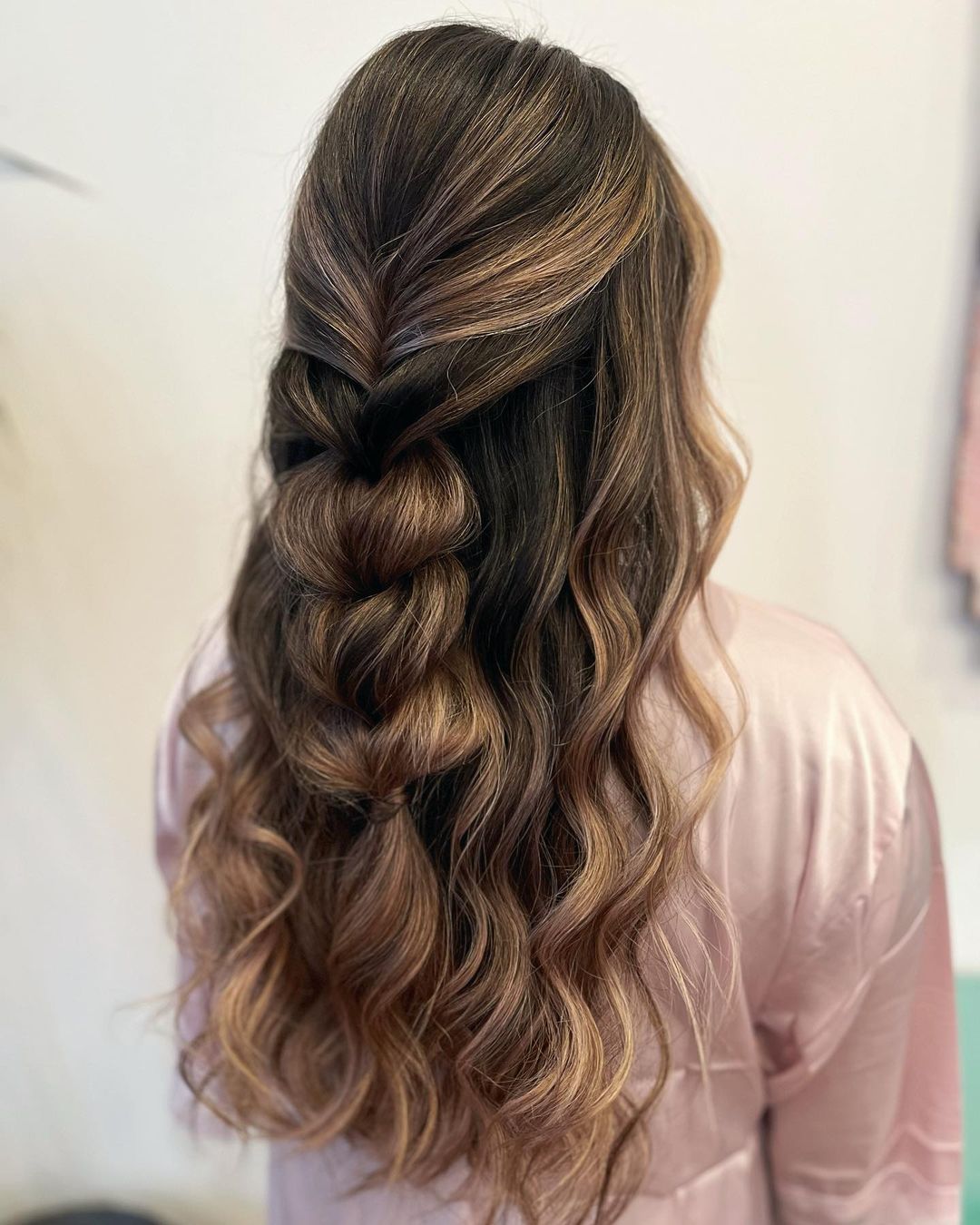 boho half updo with a fluffy pull-through braid