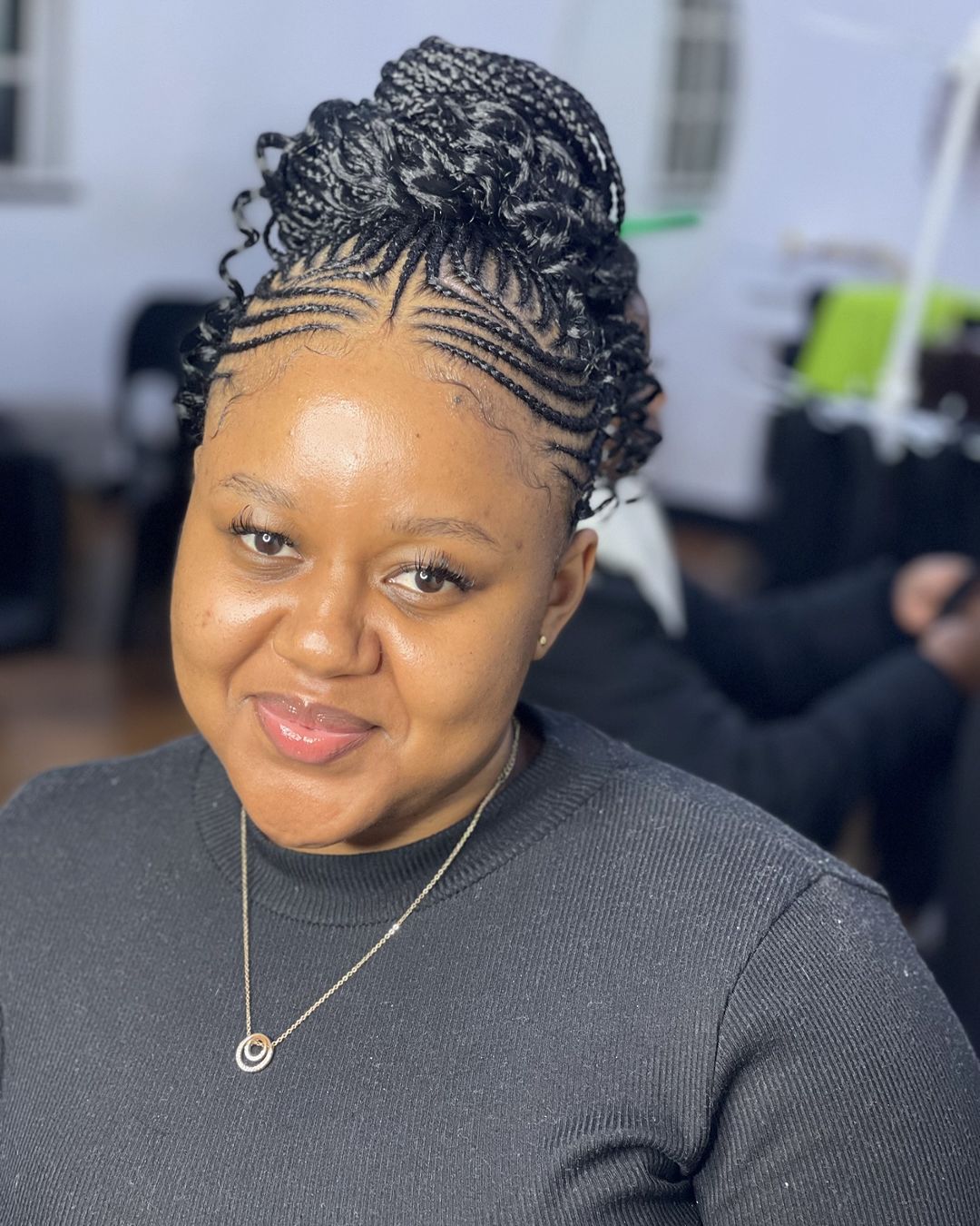 braided bun with cornrows and curly ends