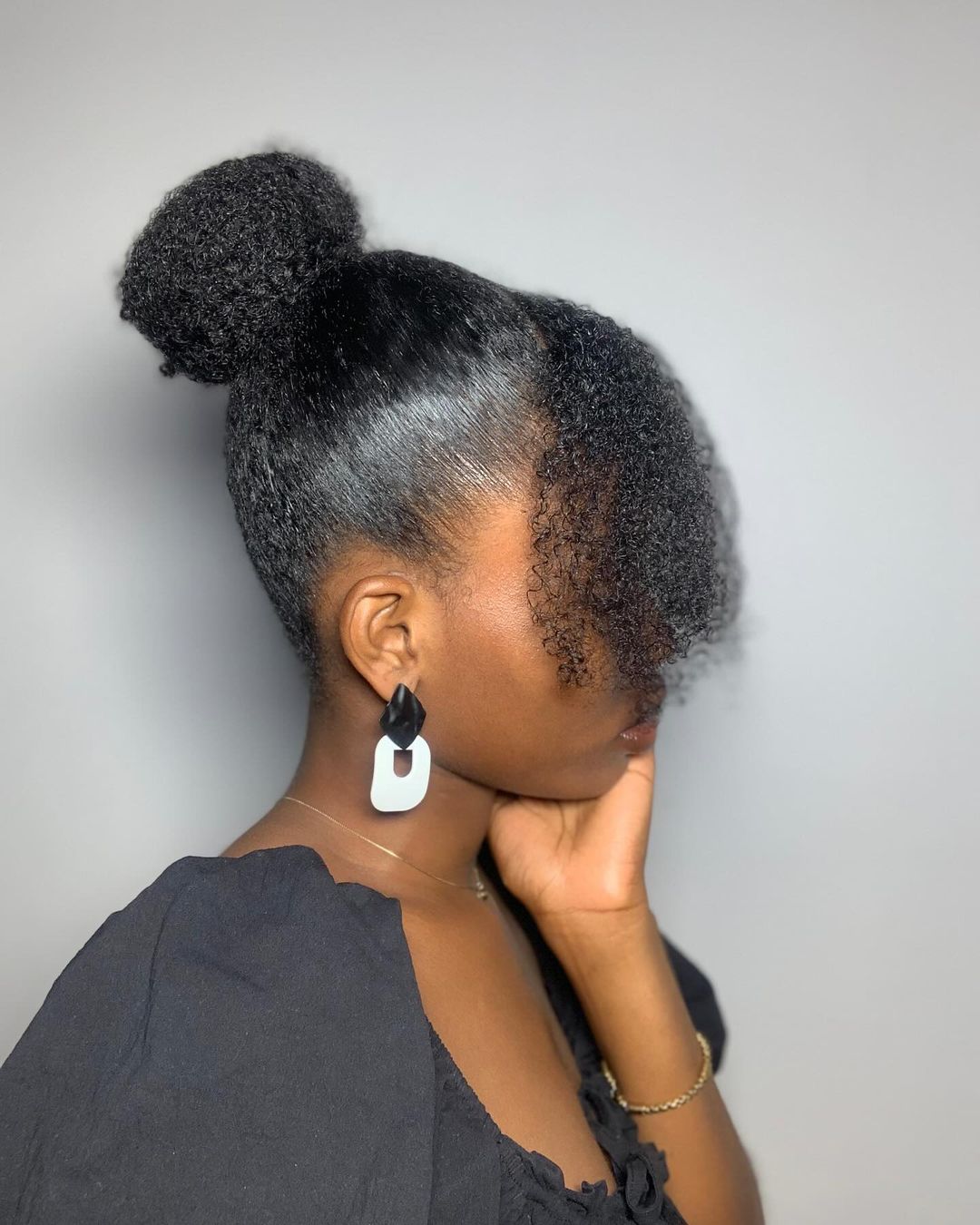 face-framing sleek top knot