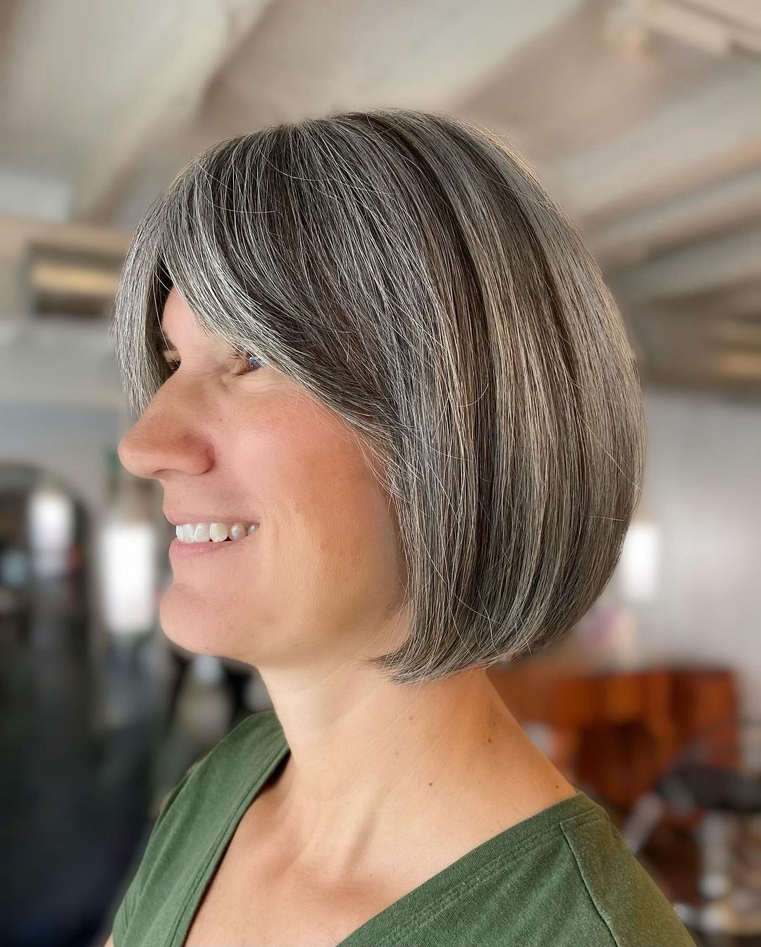 gray hair with lowlights and curtain bangs