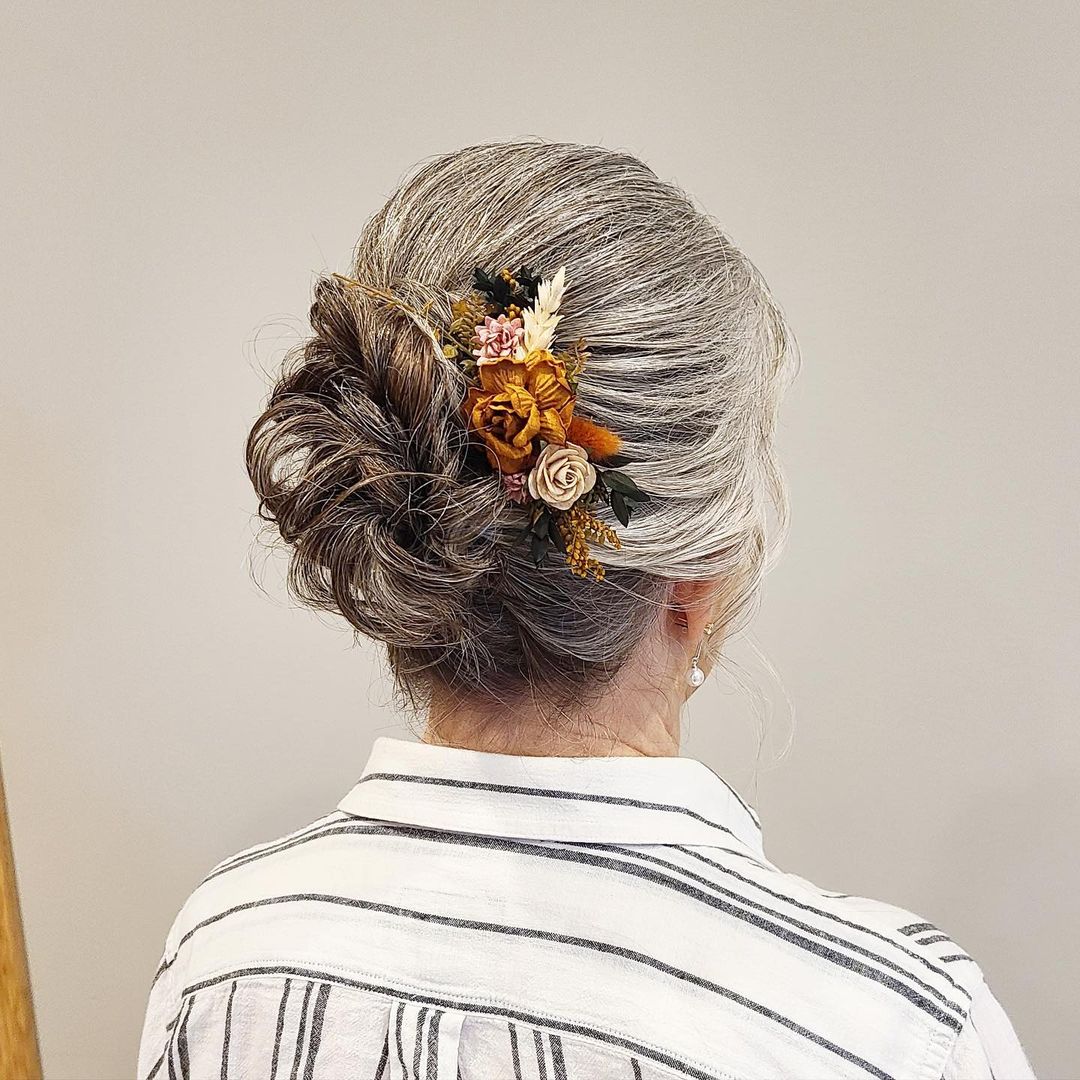 low bun with floral ornament