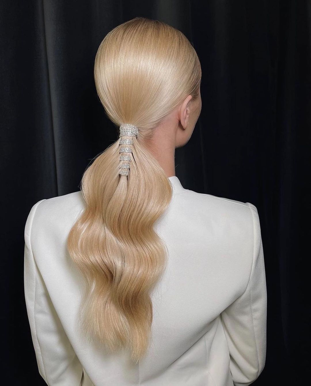 low wavy ponytail with crystal hair decoration