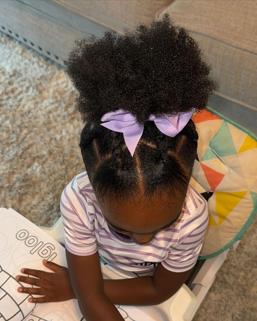 puff hairstyle with a bow