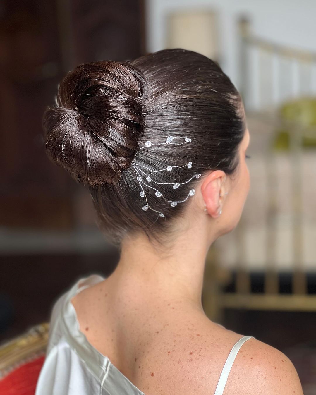 sleek high chignon with diamonds