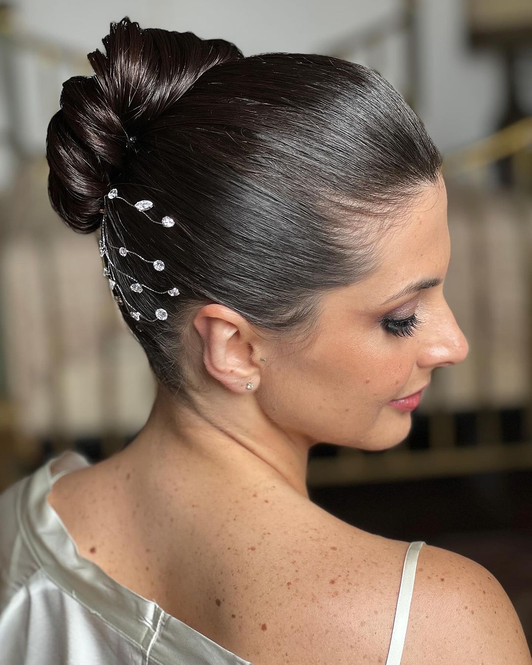 sleek high chignon with diamonds