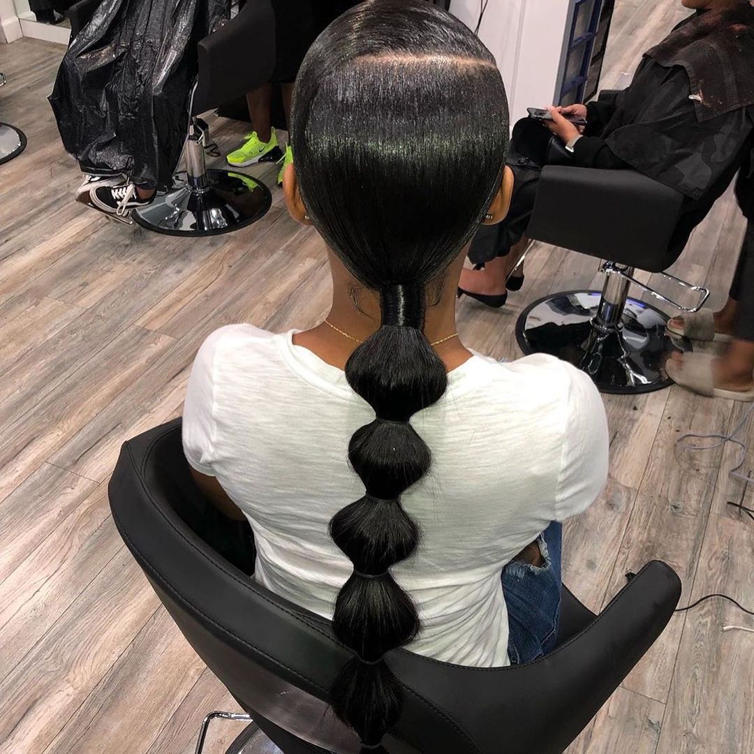 sleek low bubble ponytail