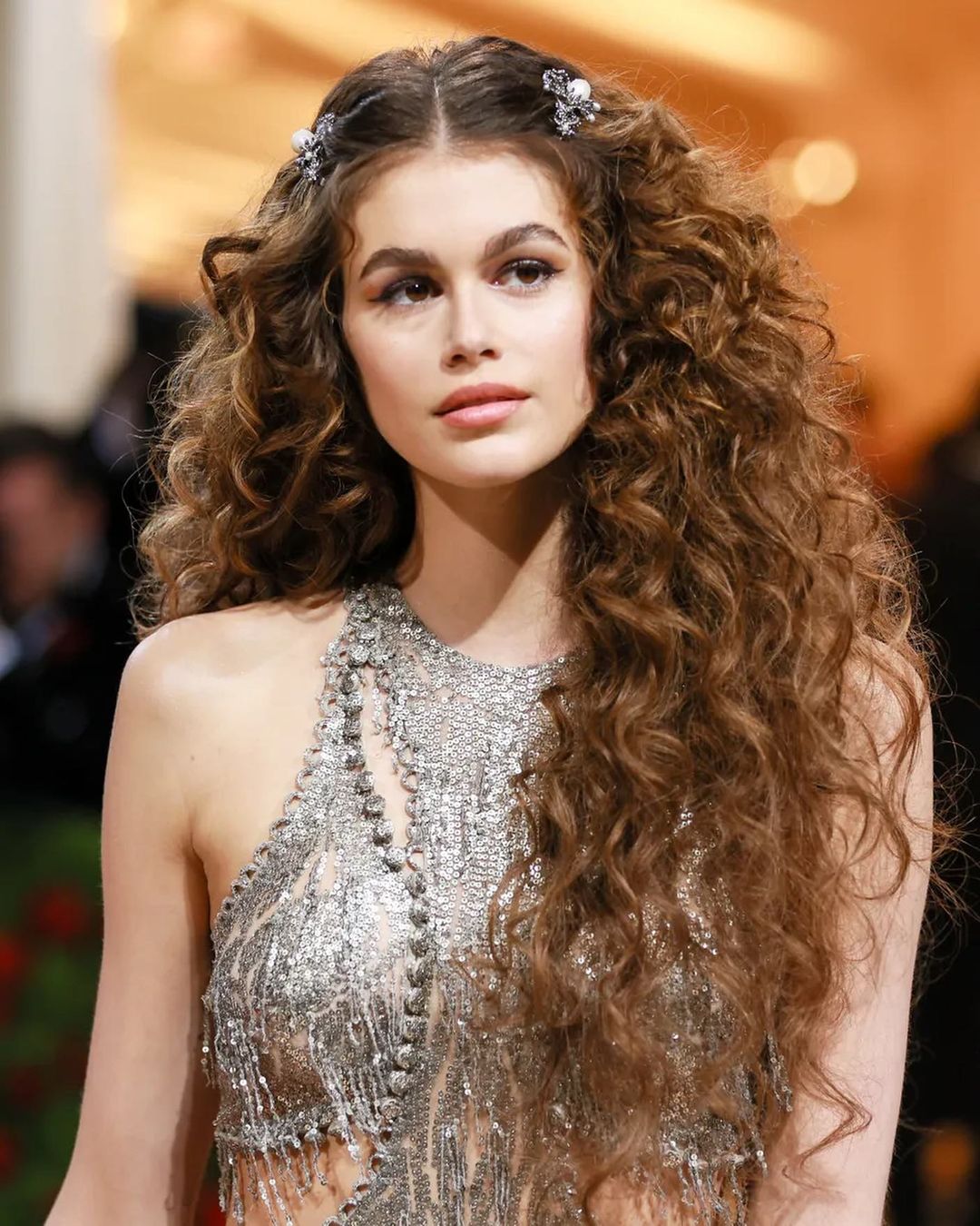 voluminous curls with decorative hair clips