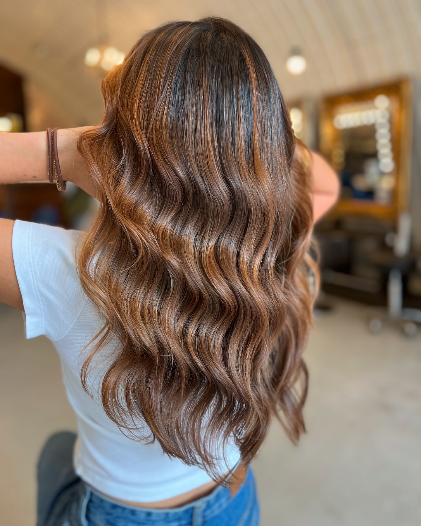 warm caramel highlights on brown hair