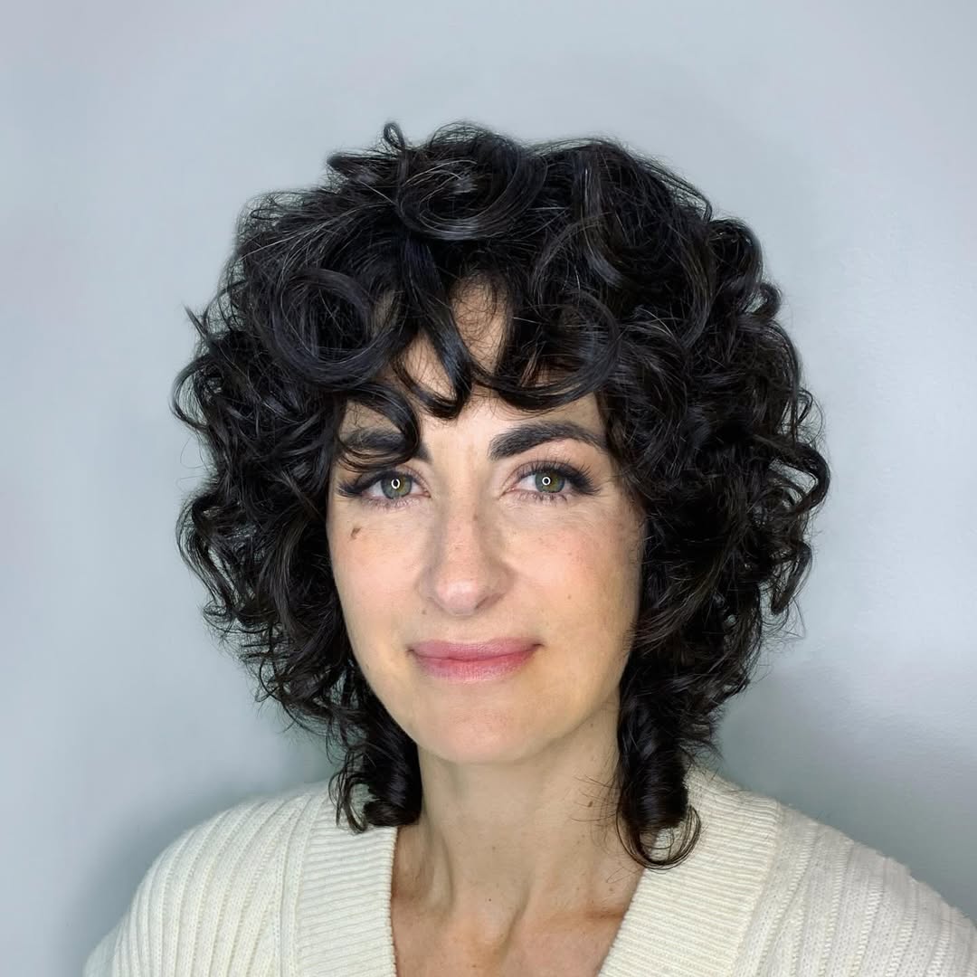 '70-Inspired Hair With Curly Bangs