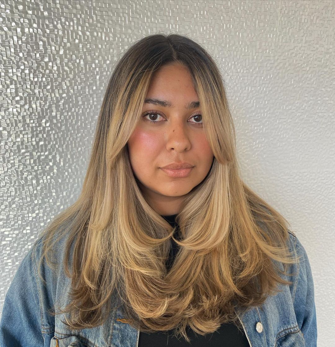 layered hair with long wispy curtain bangs