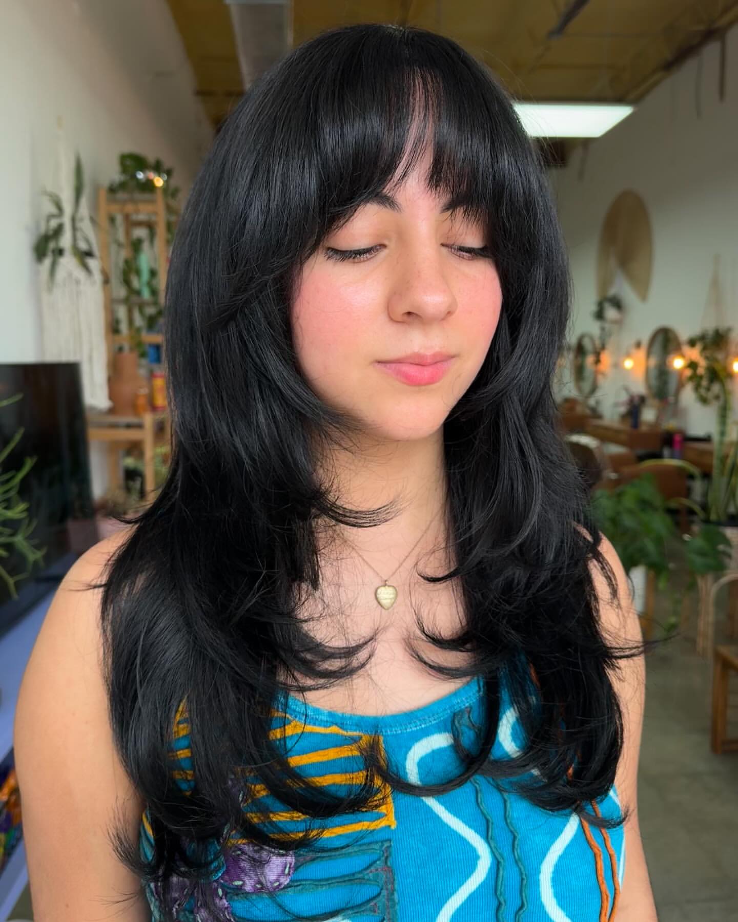 layered hair with short curtain bangs