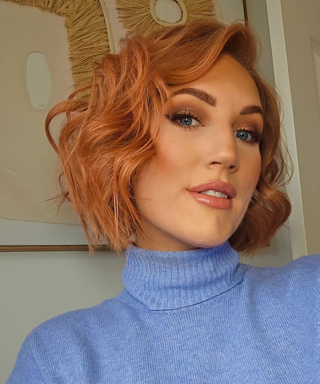 curly blunt bob with a side part