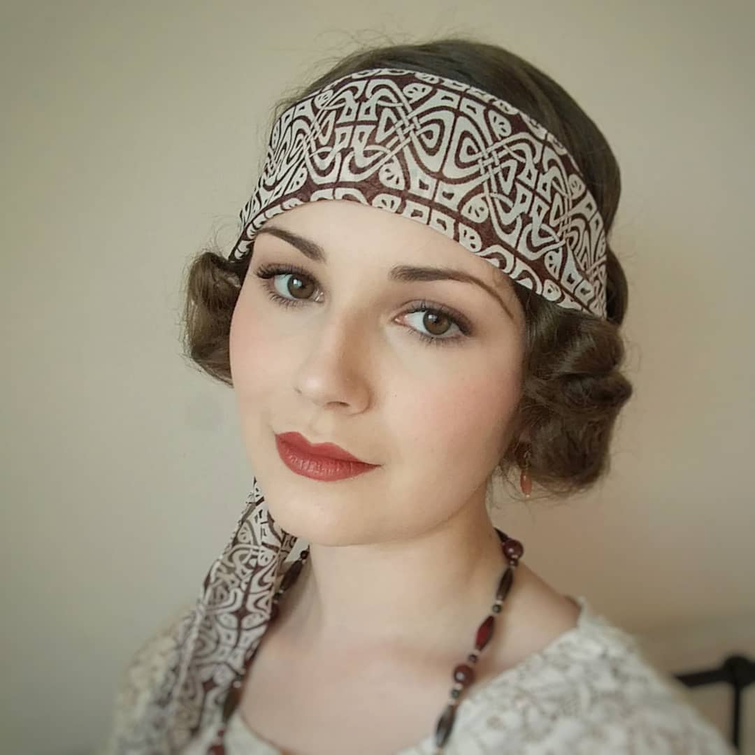 curly bob with a headscarf