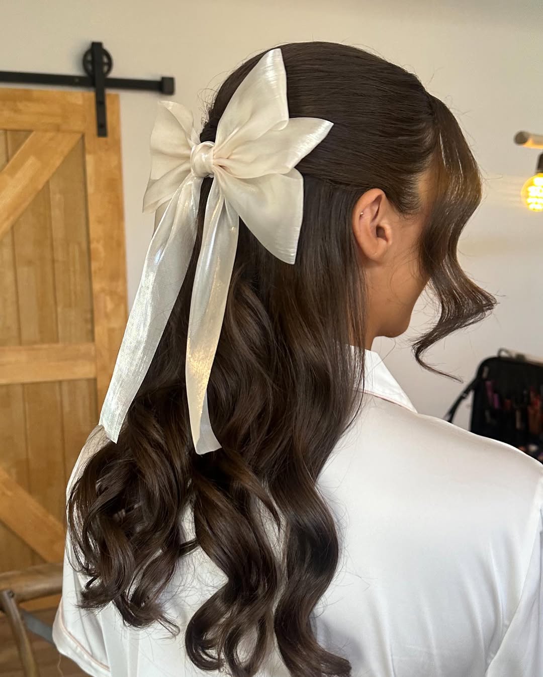 Half Updo With A White Bow