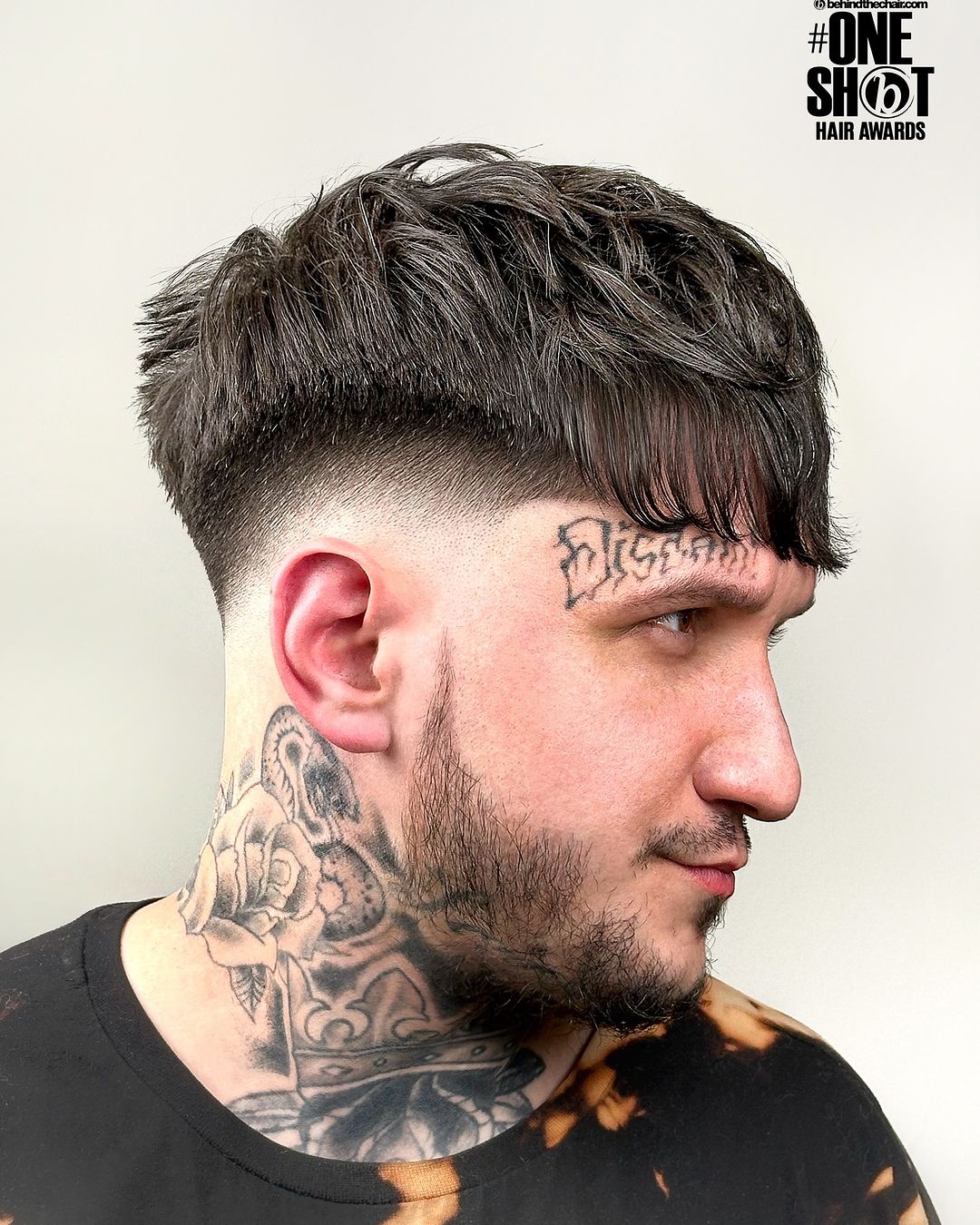 High Taper Fade Haircut With Bangs
