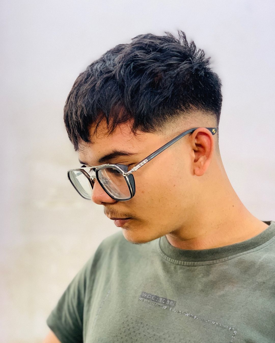 taglio di capelli mid fade