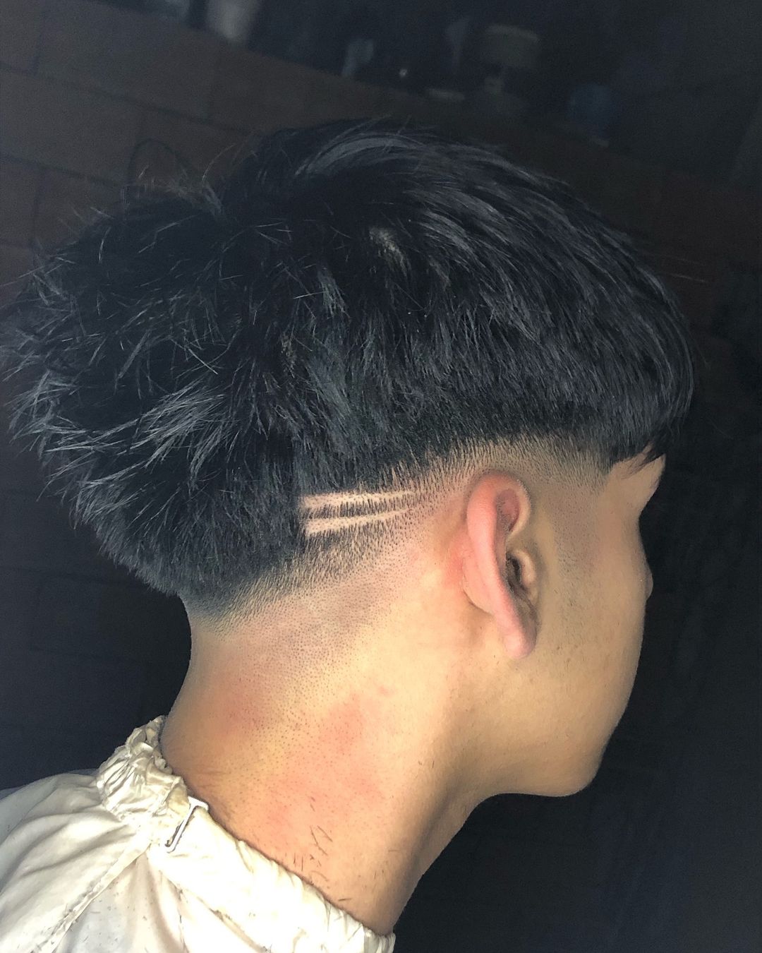 mid-fade met een vetkuif