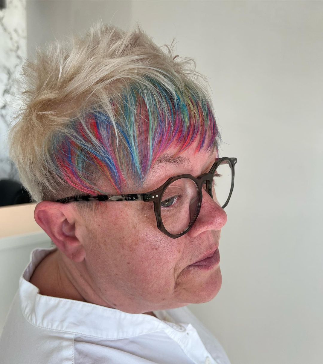 Rainbow Colored Pixie Cut For Over 50 With Glasses
