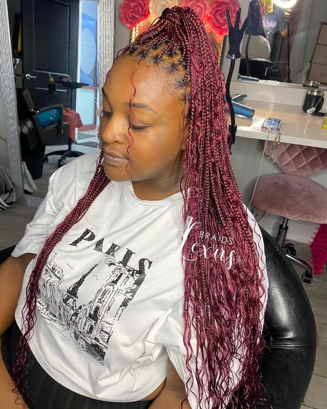 burgundy box braids in a high ponytail