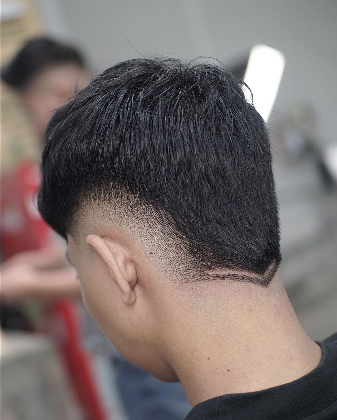 burst fade with a nape undercut design