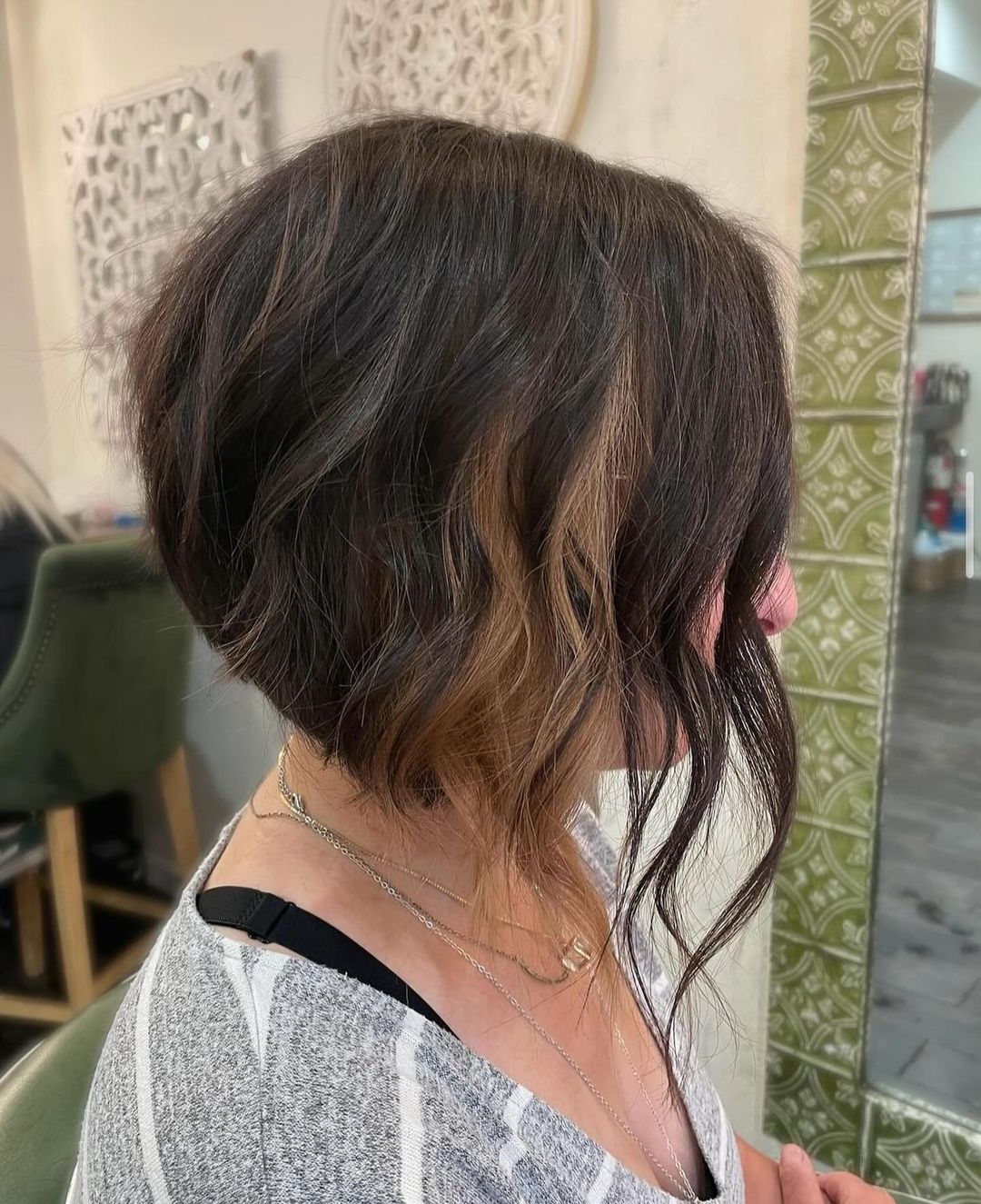 chin-length angled bob with peekaboo highlights