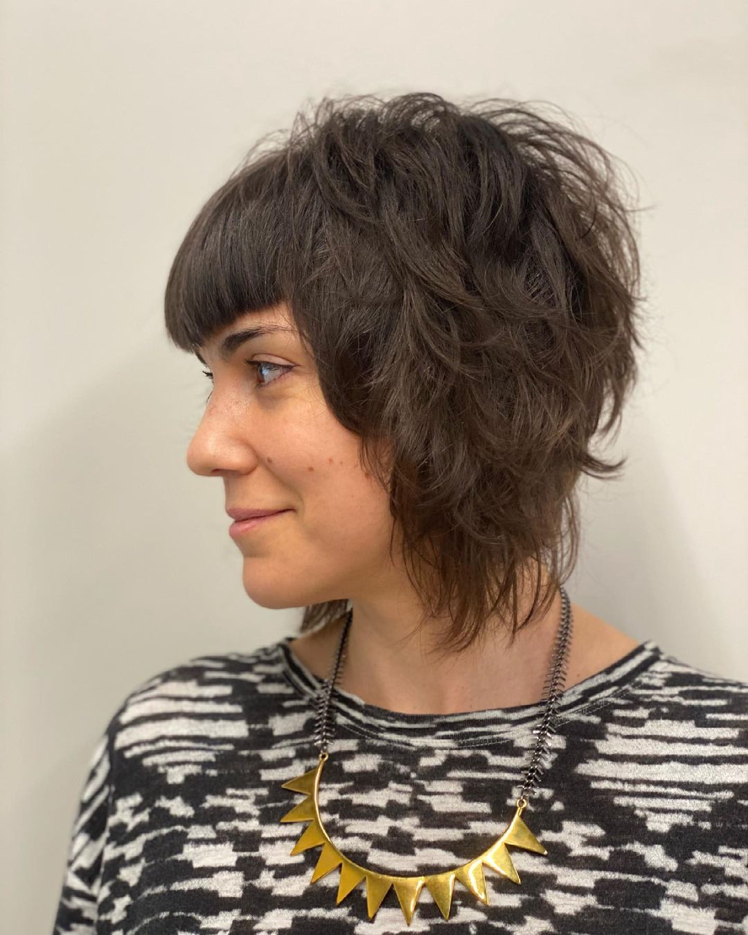 chin-length feathered bob with bangs