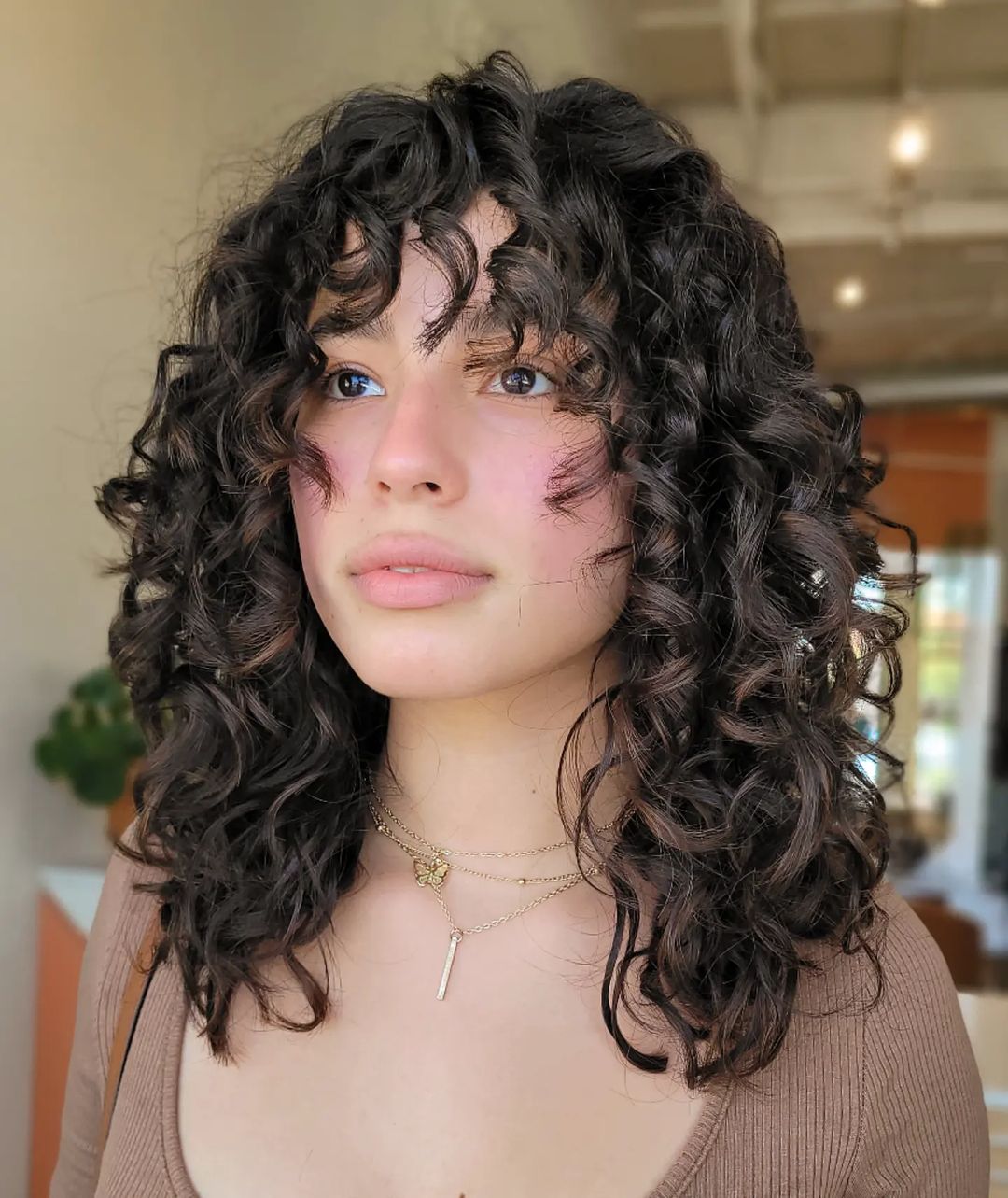 curly bangs with face-framing layers