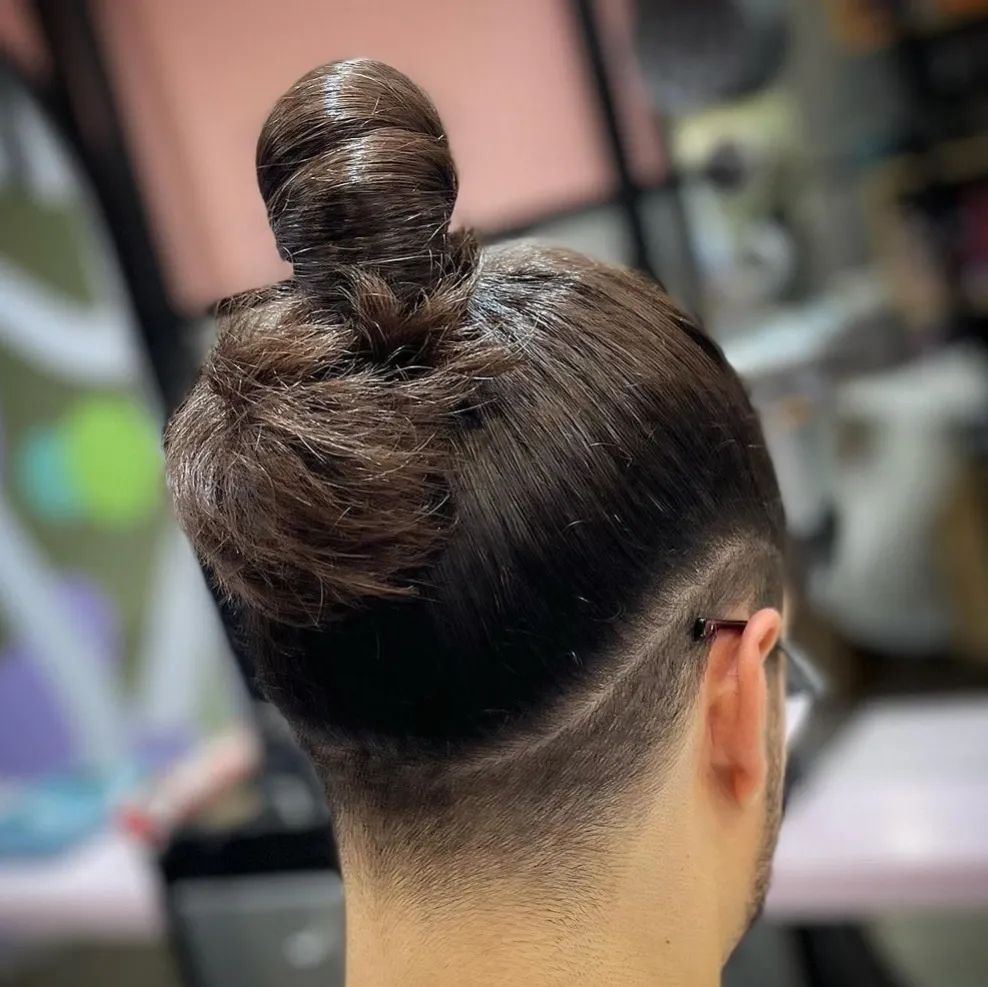 fade man bun with a nape undercut