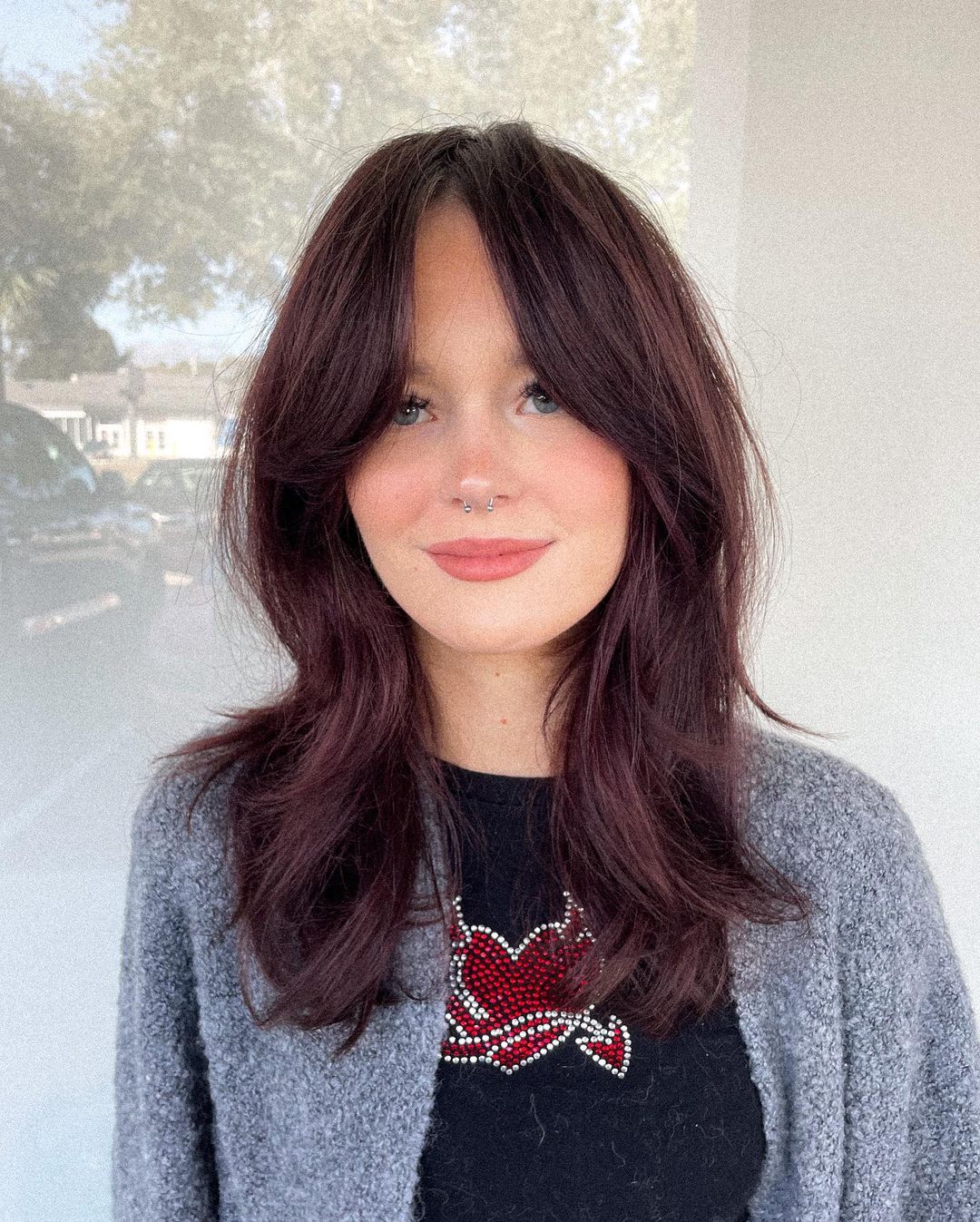 medium length haircut with curtain bangs