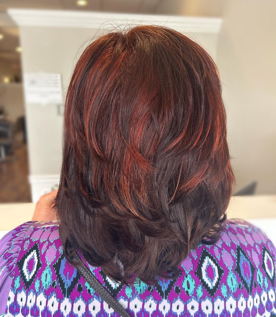 pop of red on long bob for women over 60