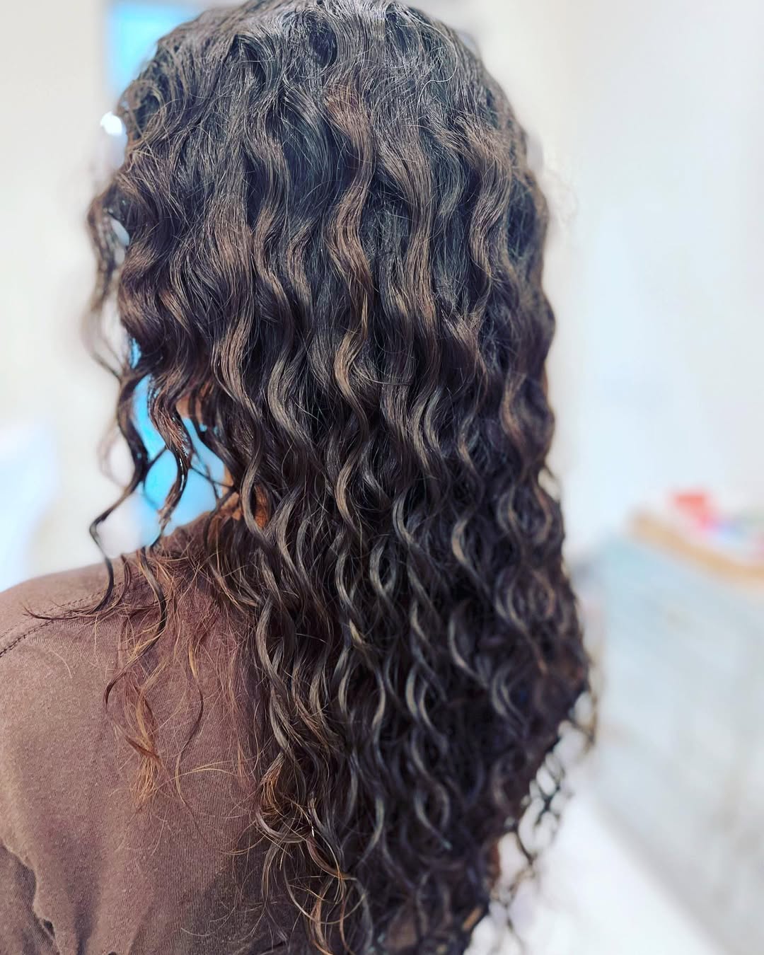 spiral perm layered hair