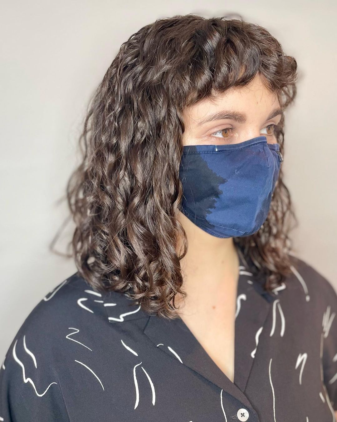 spiral perm with baby bangs