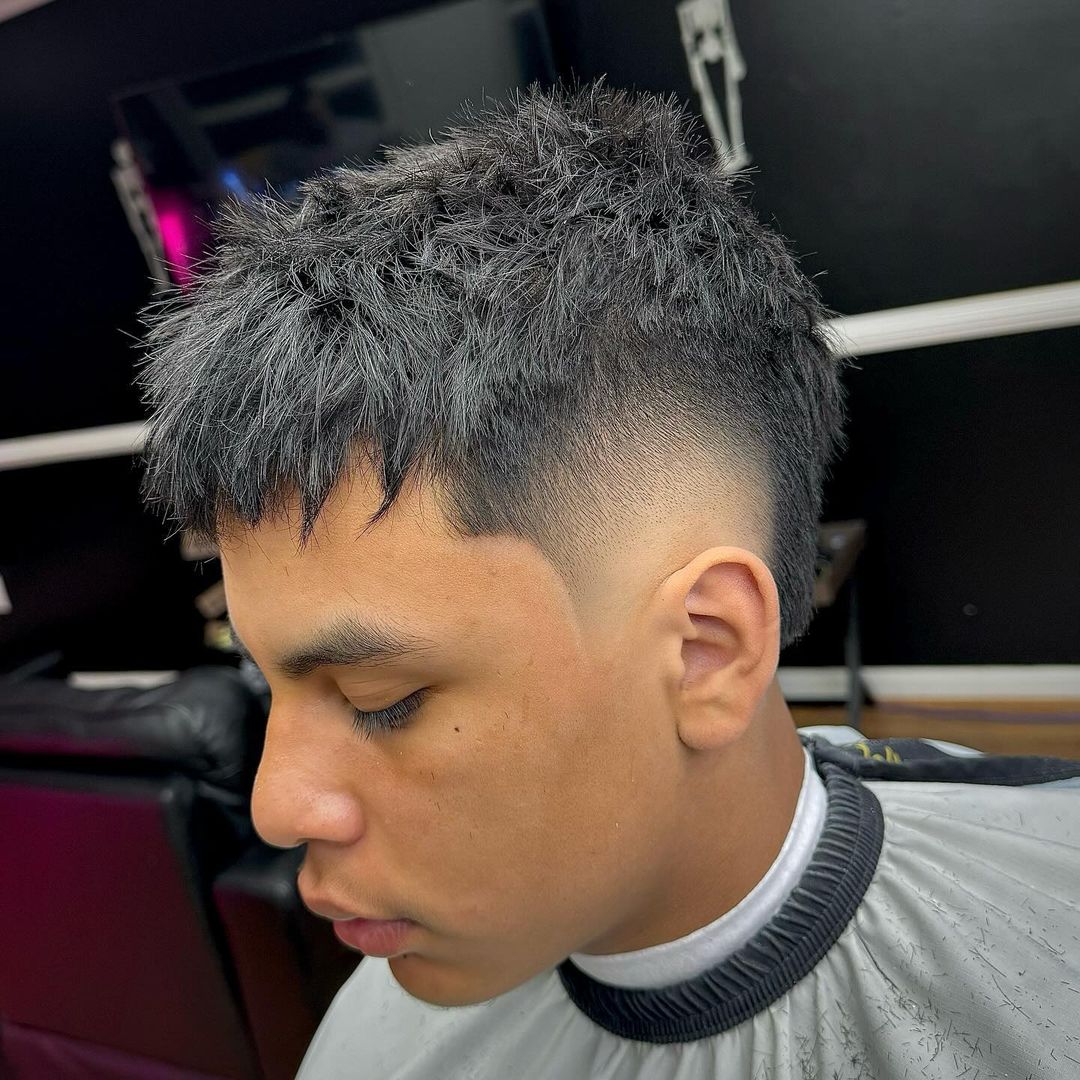 textured burst fade with choppy bangs