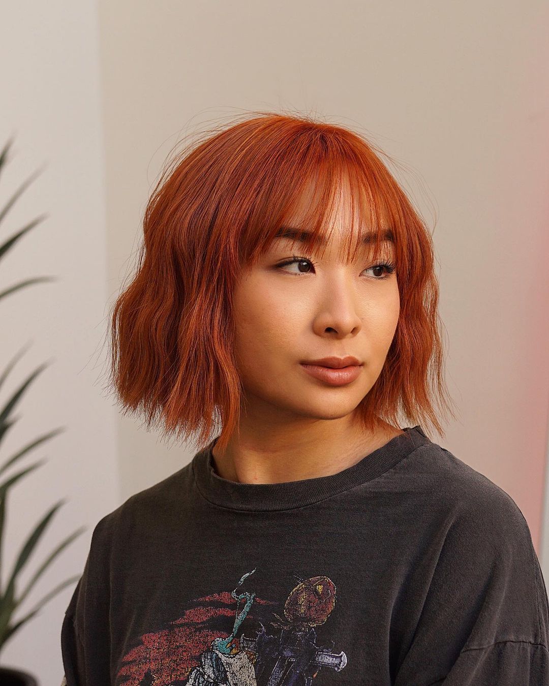 chin-length bob with wispy bangs