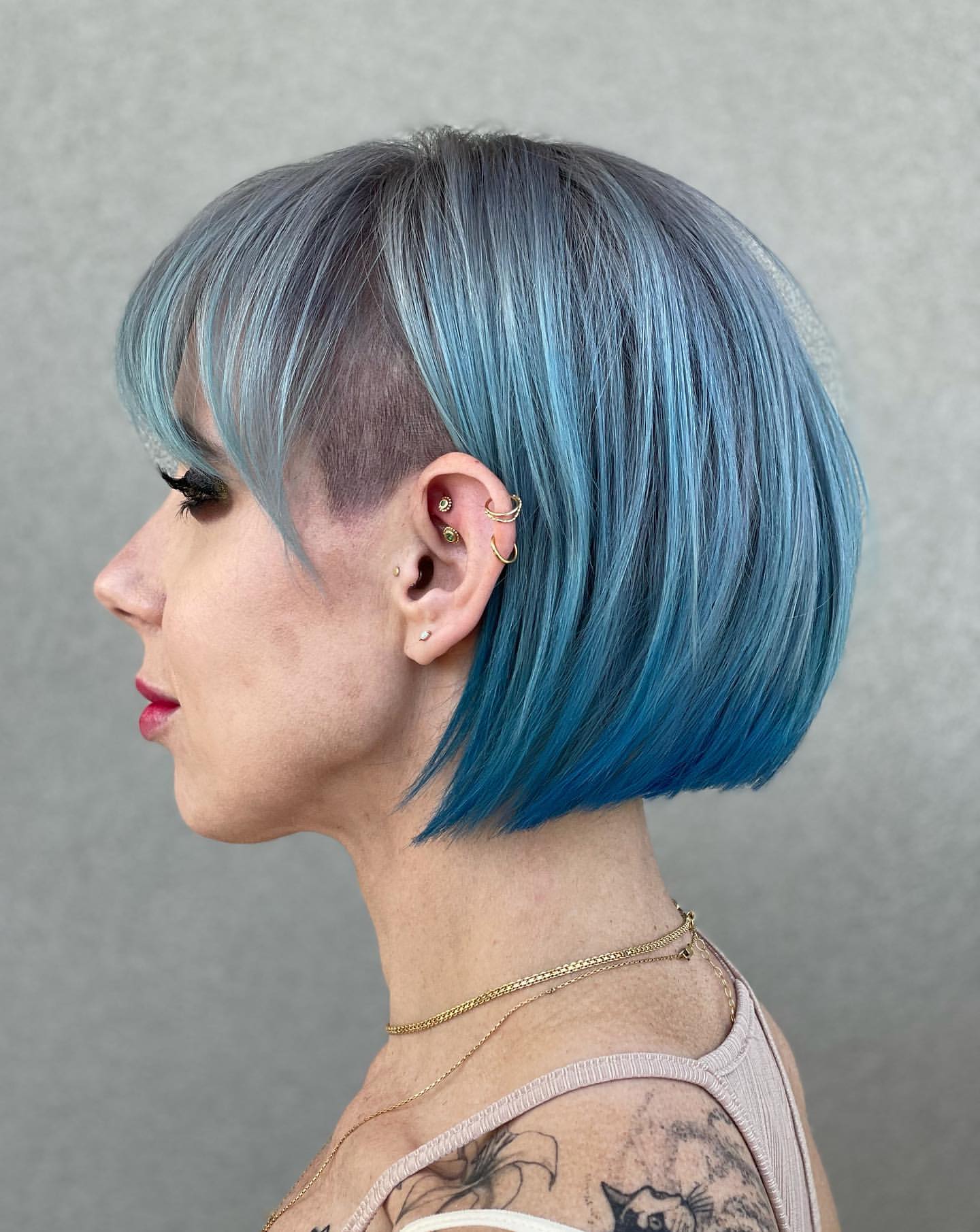 chin-length bob with bangs and undercut