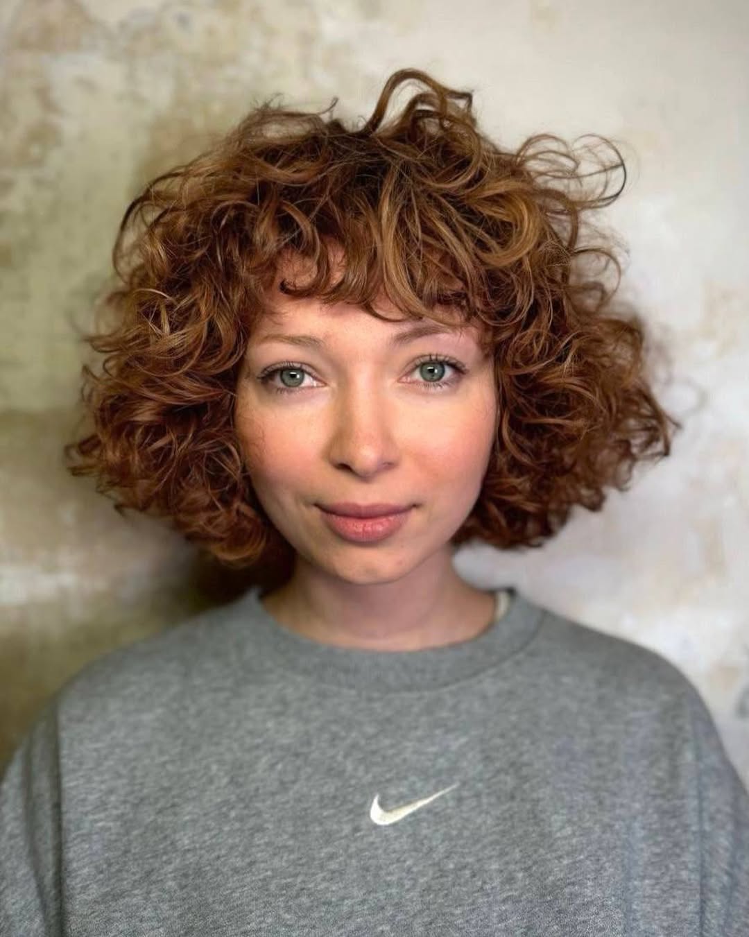 curly bob with bangs