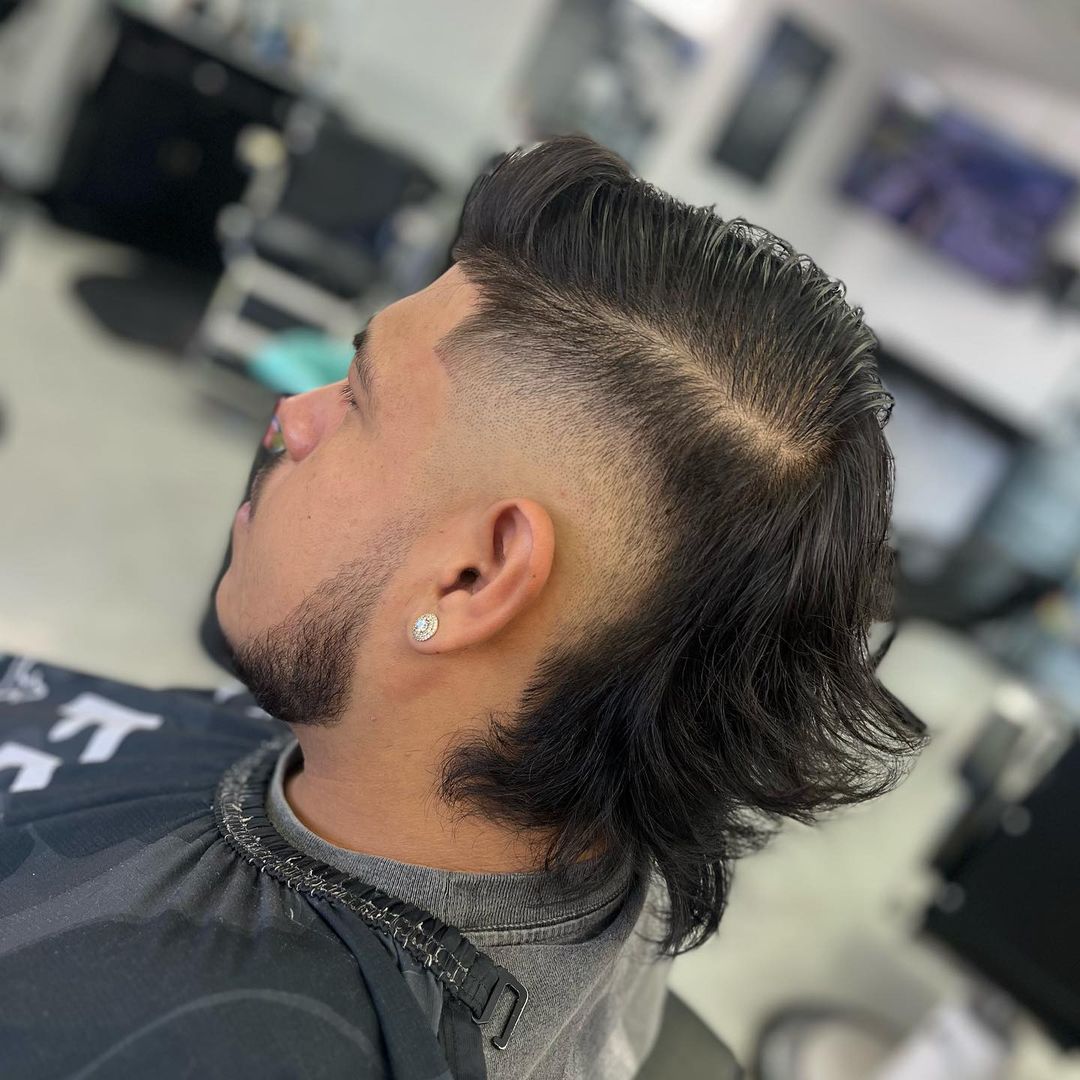 sleek mid burst fade mullet