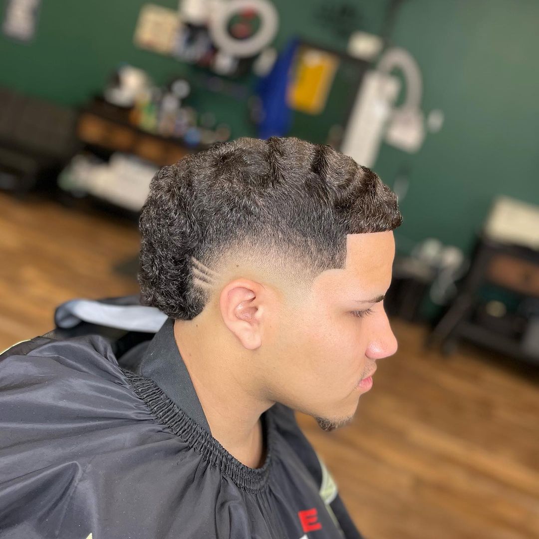 wavy curly mid burst fade haircut