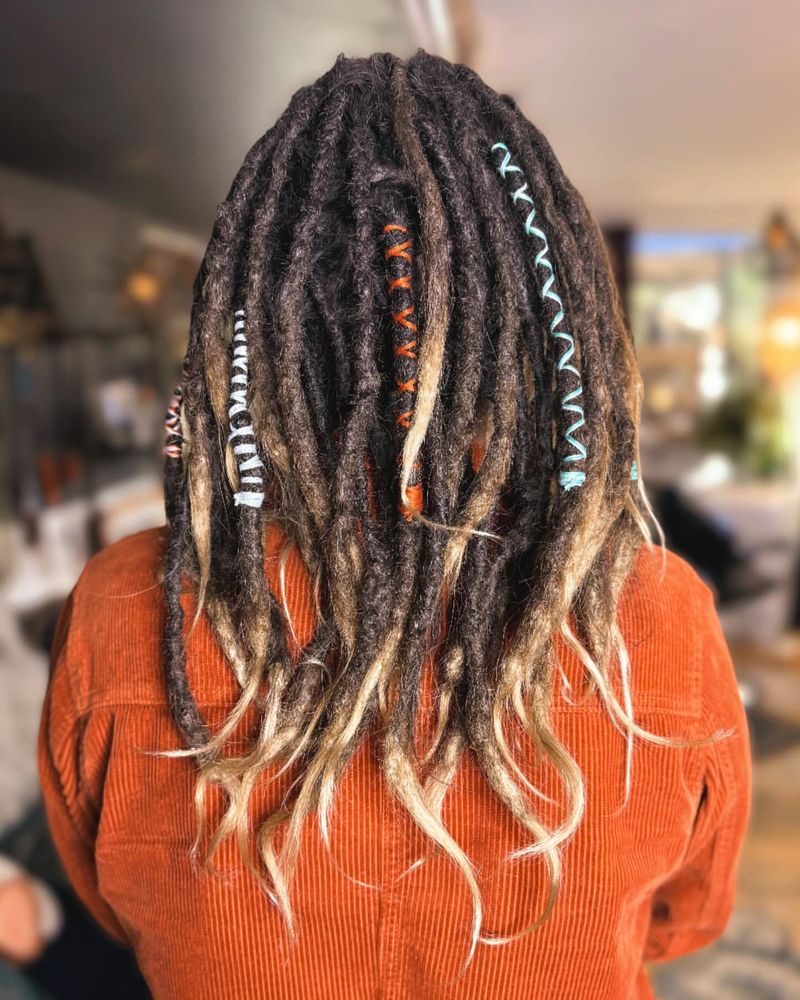 Locs with Feather Accents