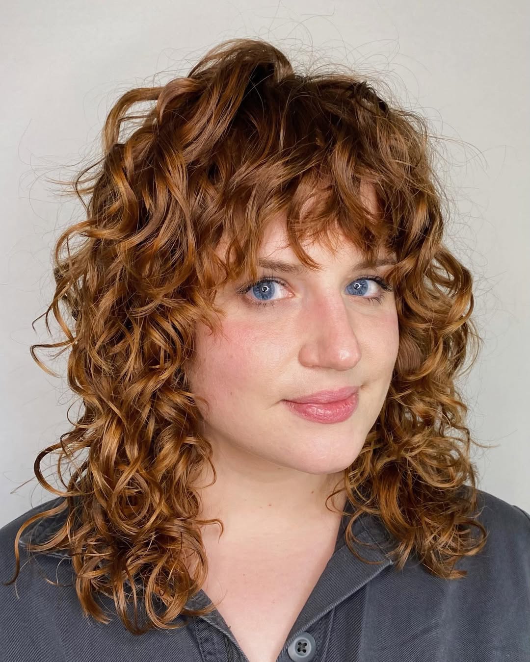 shaggy perm hair with bangs