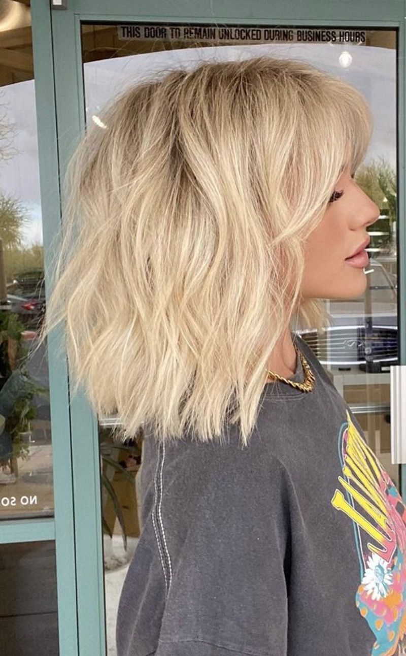 Scandinavian Blunt Cut with Disconnected Layers and Eyebrow Bangs