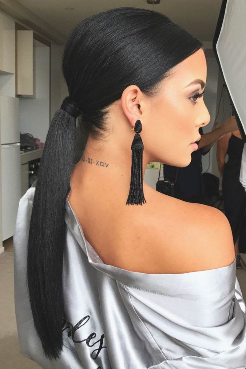 Sleek Low Ponytail with Volume at Crown