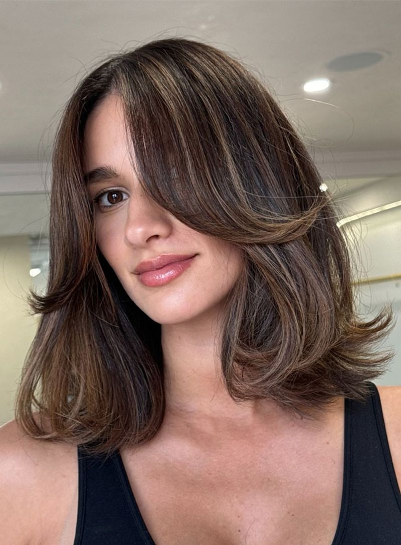 Voluminous Layers with Curtain Bangs