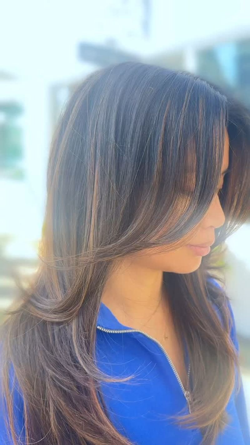 Long Layers with Side-Swept Bangs