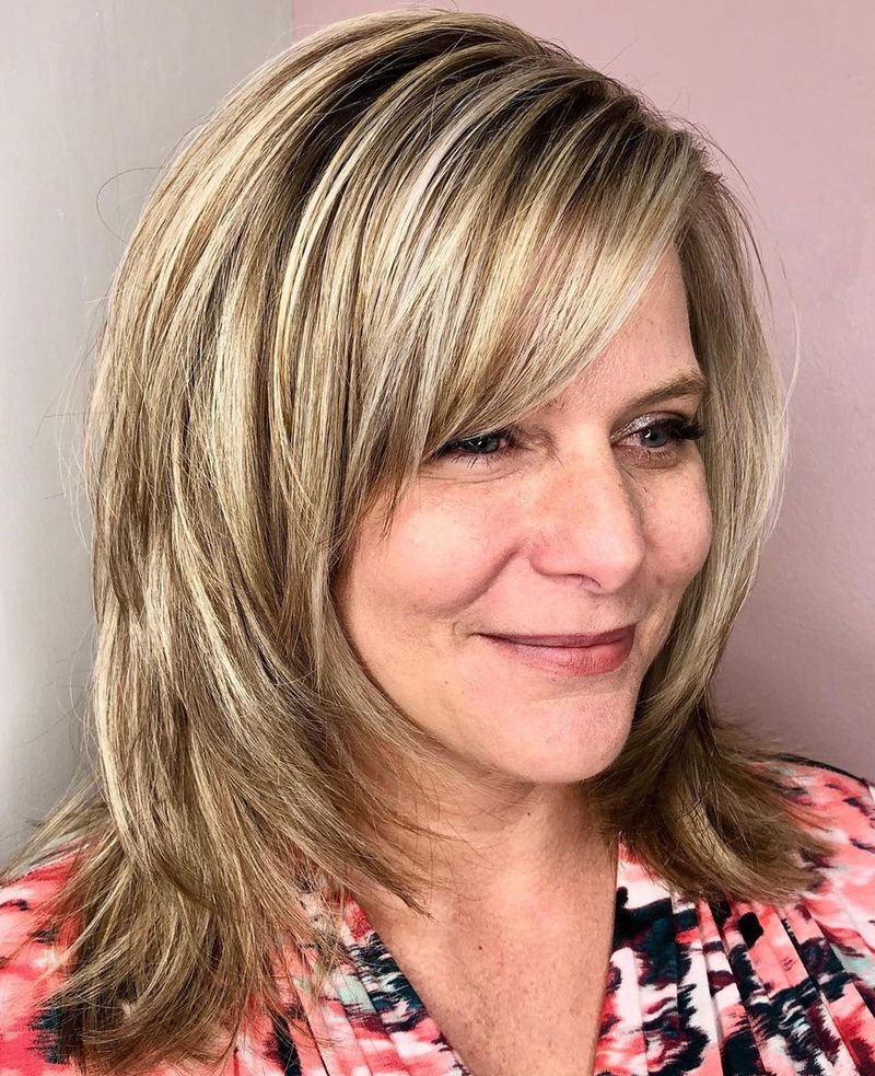 Shoulder-Length Layers with Side-Swept Bangs