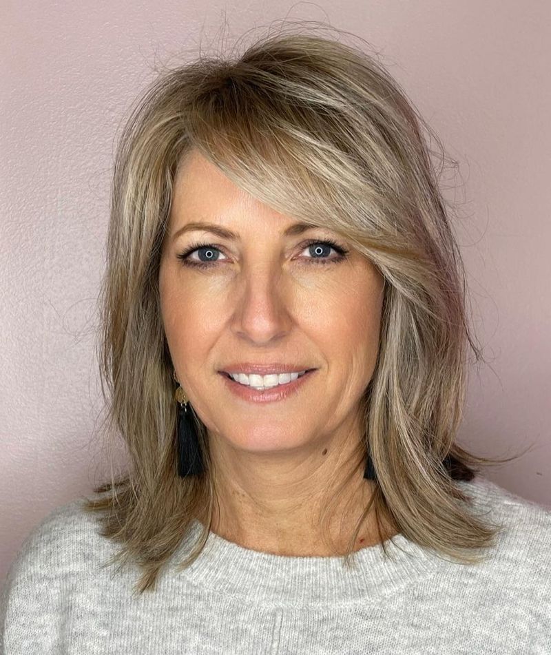 Shoulder-Length Layers with Side-Swept Bangs