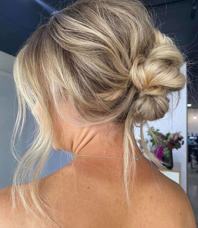 Loose Messy Bun with Face-Framing Tendrils