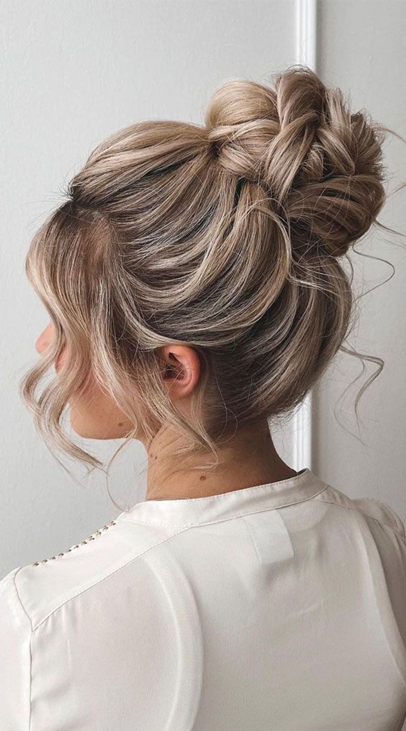 Messy Top Knot with Face-Framing Pieces